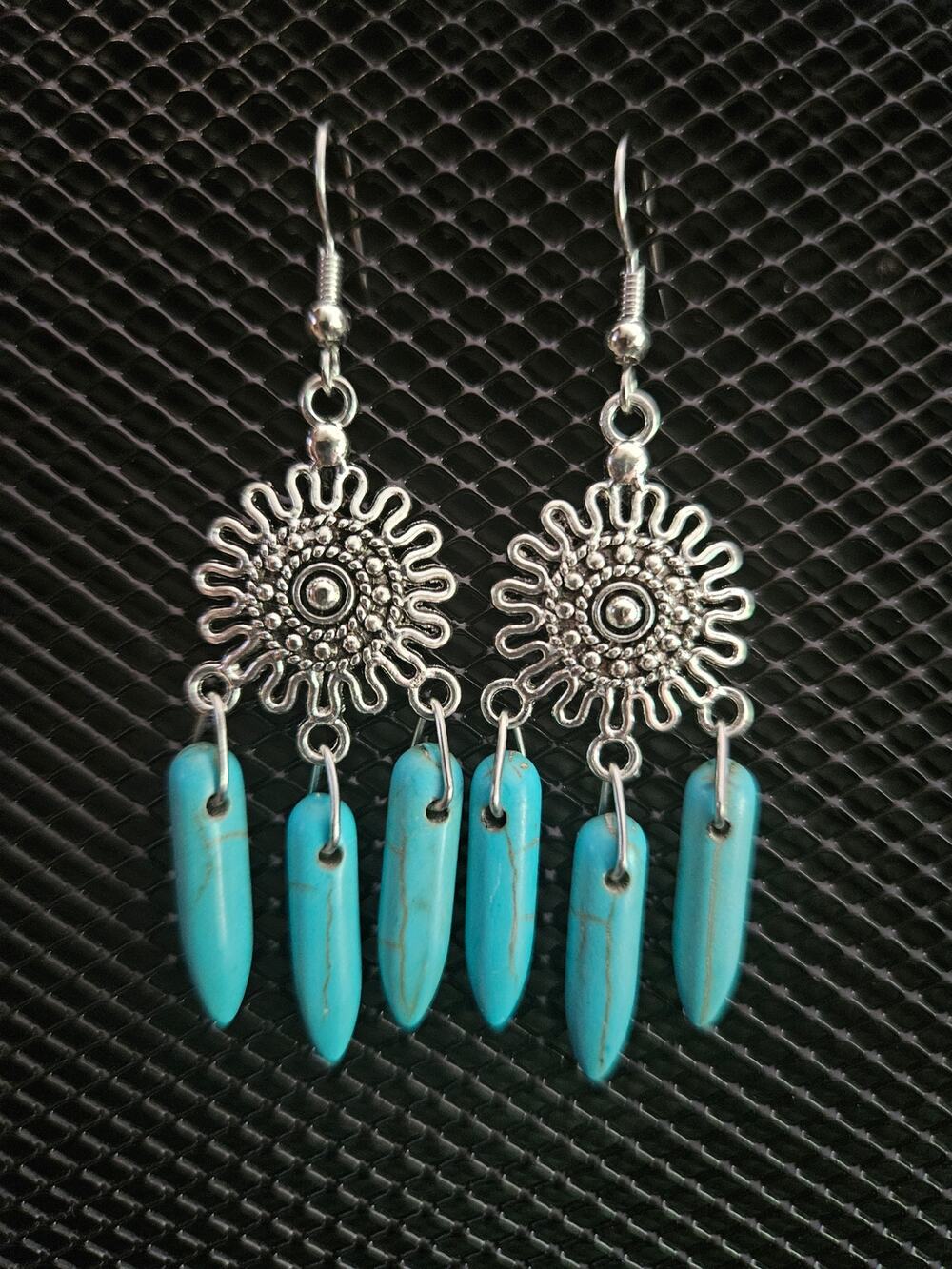 Antique silver sunburst and dyed howlite dagger chandelier earrings